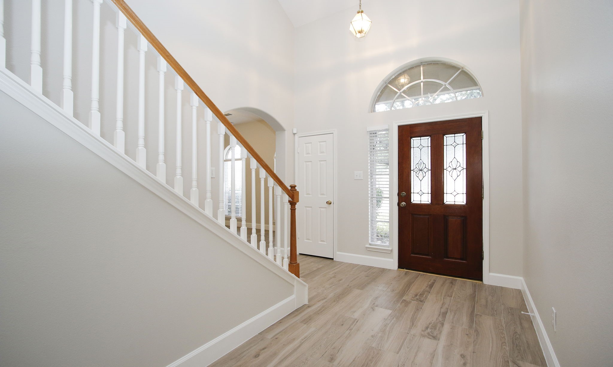 27131 Sunset Pines Drive Spring, TX 77373 - Photo 6 of 44 a view of staircase with wooden floor and staircase