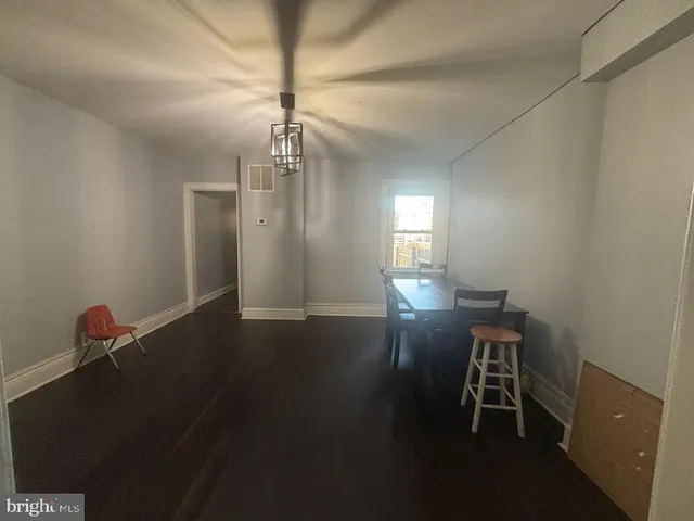 a view of a livingroom with furniture and wooden floor