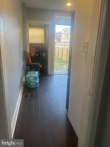 a view of livingroom with furniture and hardwood floor