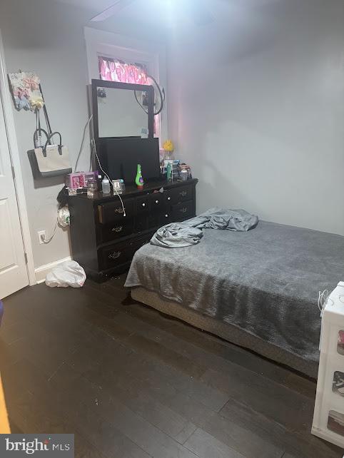 7014 Belclare Road Baltimore, MD 21222 - Photo 8 of 15 a bedroom with a bed and dresser