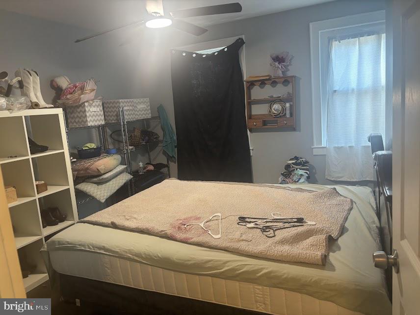 7014 Belclare Road Baltimore, MD 21222 - Photo 10 of 15 a bedroom with a bed and a window
