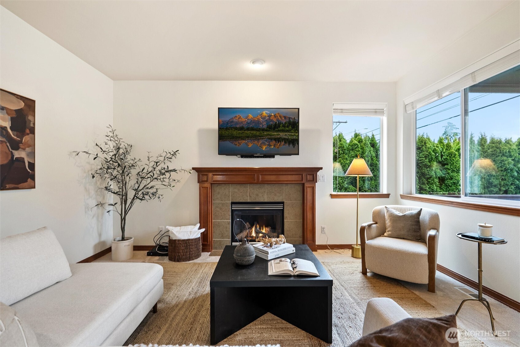 18722 3rd Avenue West Bothell, WA 98012 - Photo 13 of 35 a living room with furniture a fireplace and a flat screen tv