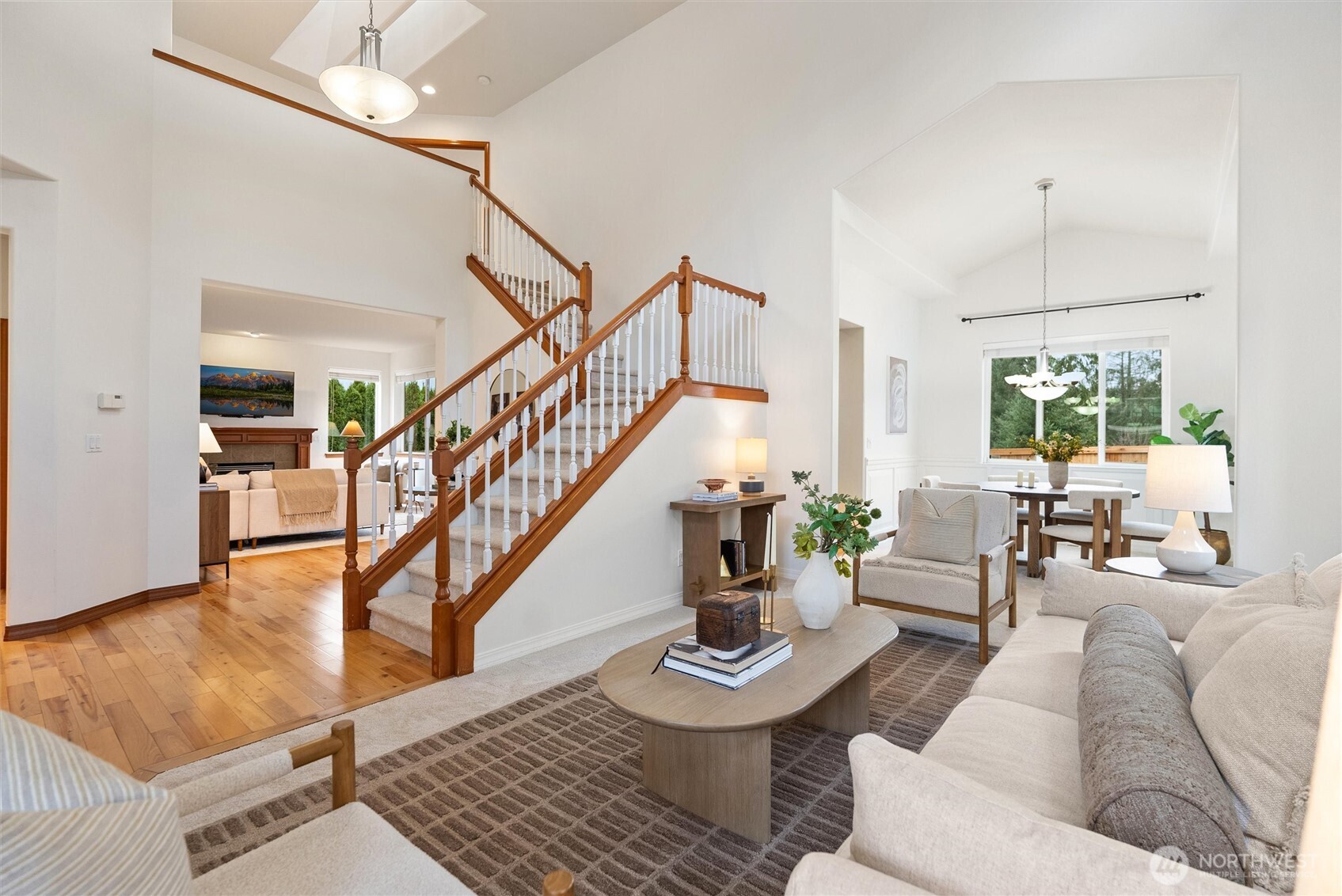 18722 3rd Avenue West Bothell, WA 98012 - Photo 5 of 35 a living room with furniture and a dining table with white walls
