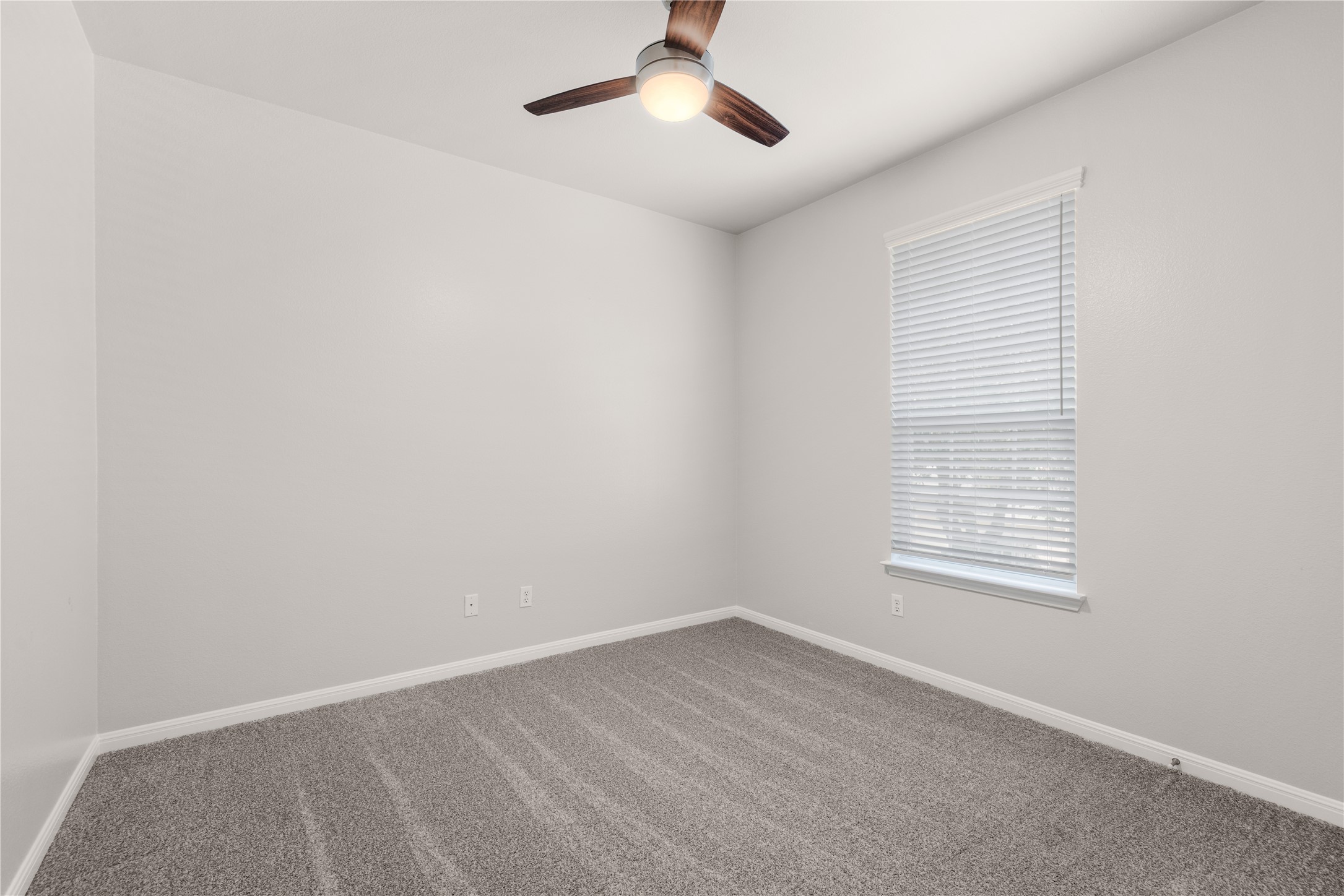 11000 Anderson Mill Road, Unit 45 Austin, TX 78750 - Photo 22 of 32 an empty room with a window and a fan