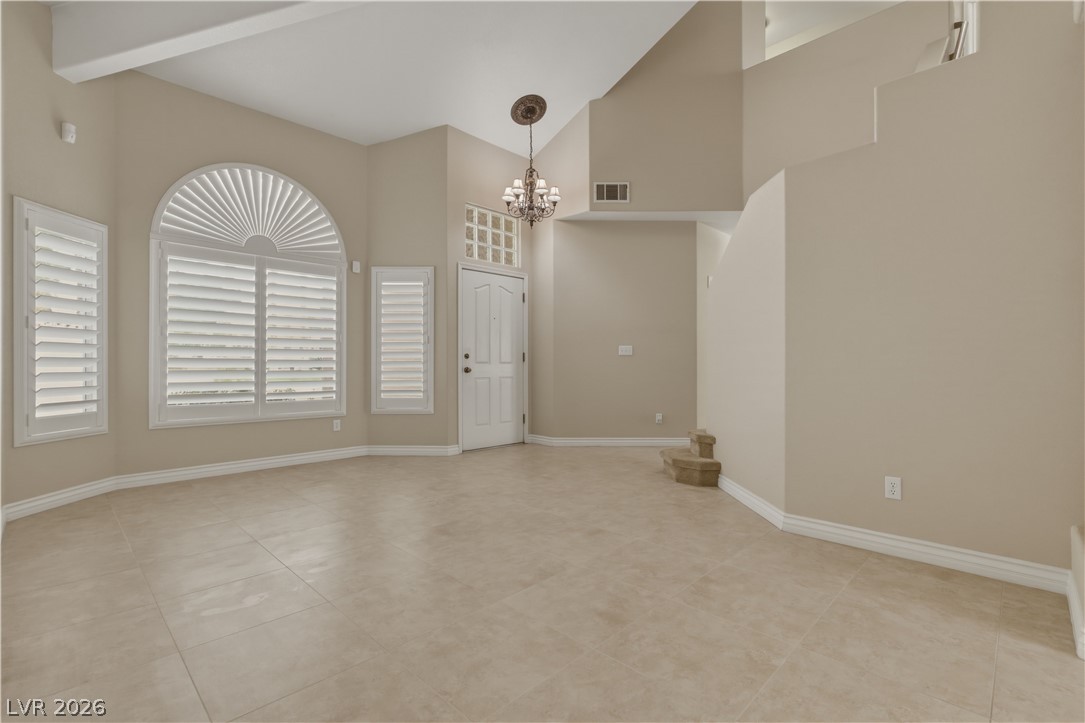 29 Olive Tree Henderson, NV 89074 - Photo 8 of 60 This bright, spacious living area features high ceilings, elegant flooring, and ample natural light.