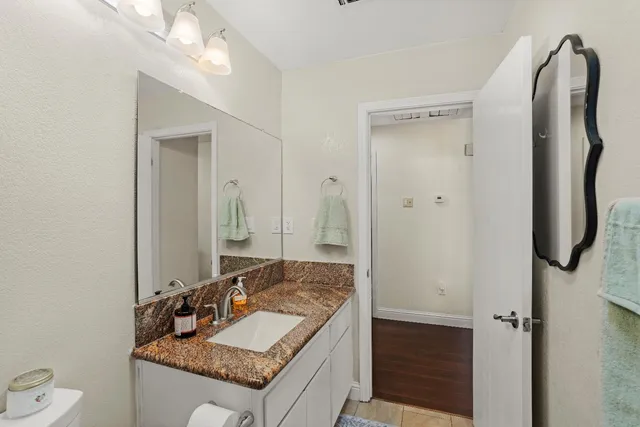 a view of a barn in the middle of a yard