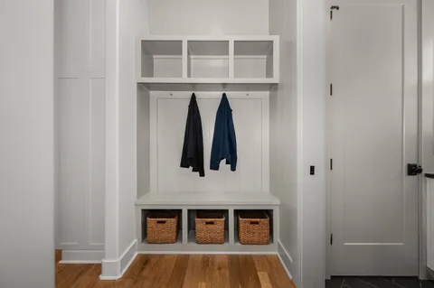 a view of a room that has a bed and a cabinet