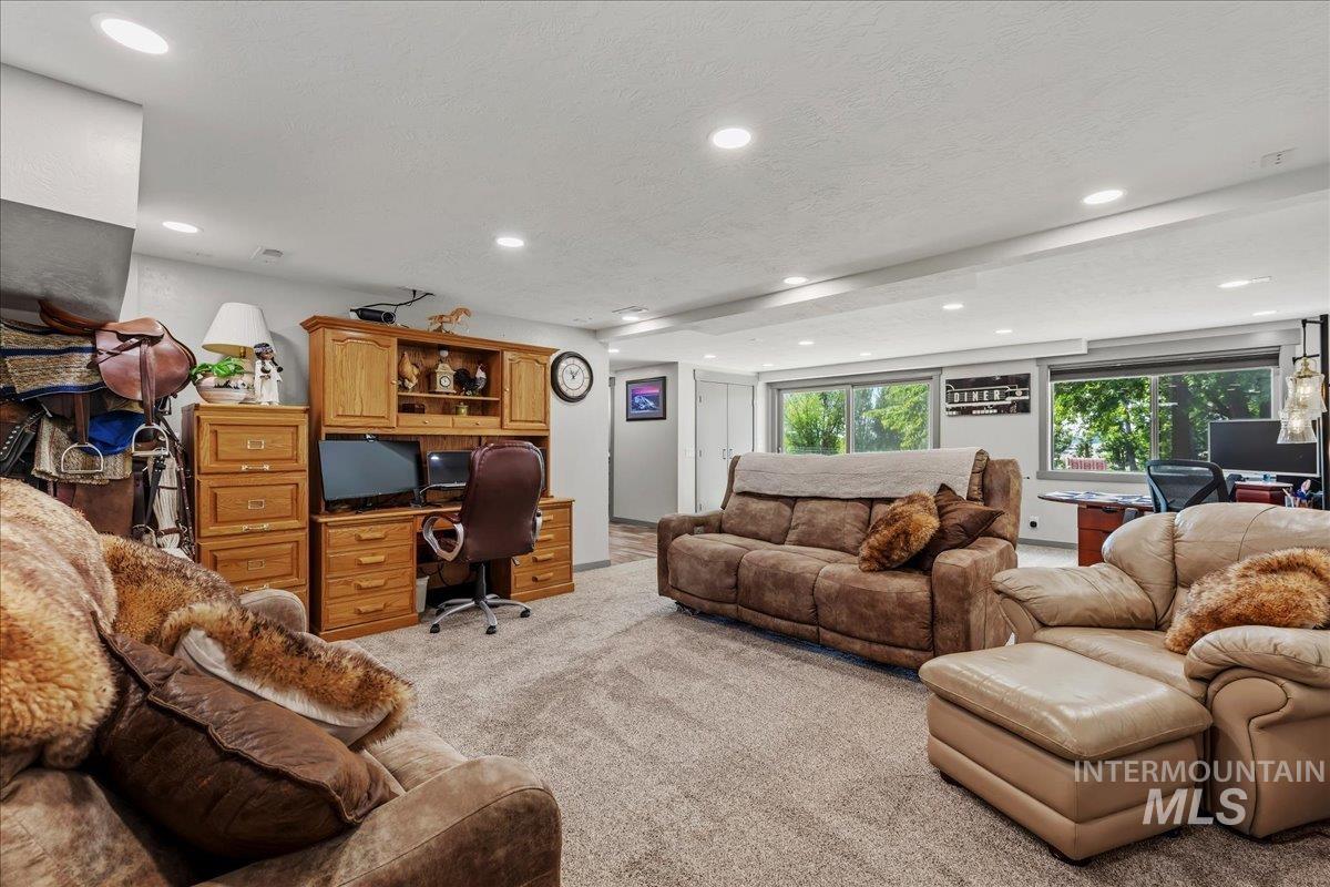 6323 Foothill Road Star, ID 83669 - Photo 15 of 50 Spacious room featuring broadloom carpet, recessed lighting, and a wood-finish built-in desk with shelving