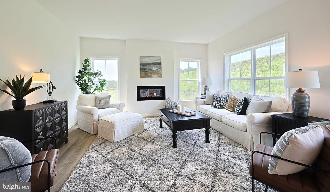 109 Copper Ridge Drive Newmanstown, PA 17073 - Photo 14 of 27 a living room with furniture fireplace and a large window