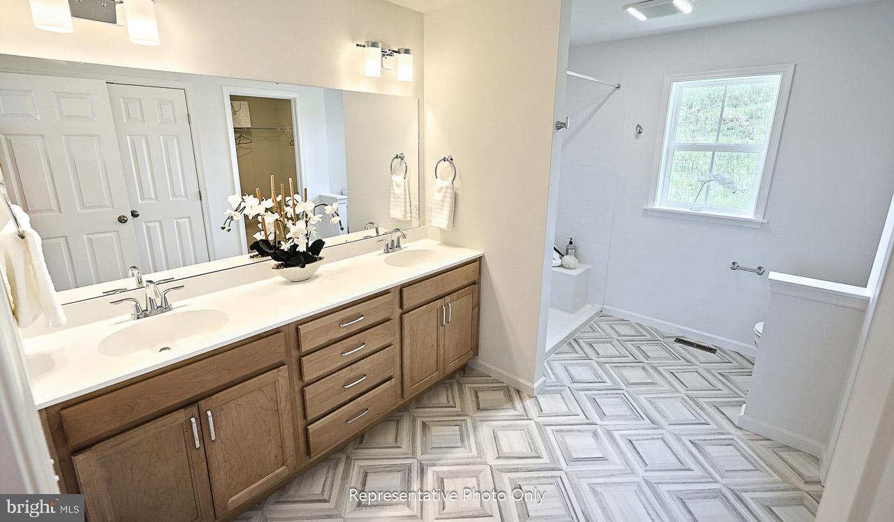 109 Copper Ridge Drive Newmanstown, PA 17073 - Photo 19 of 27 a bathroom with a sink mirror and a toilet