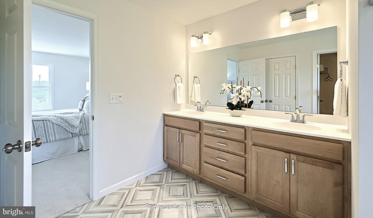 109 Copper Ridge Drive Newmanstown, PA 17073 - Photo 20 of 27 a bathroom with a double vanity sink mirror and next to a window