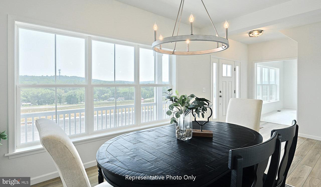 109 Copper Ridge Drive Newmanstown, PA 17073 - Photo 2 of 27 a view of a dining room with furniture window and wooden floor