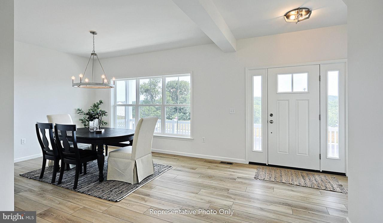 109 Copper Ridge Drive Newmanstown, PA 17073 - Photo 3 of 27 a view of a dining room with furniture window and wooden floor