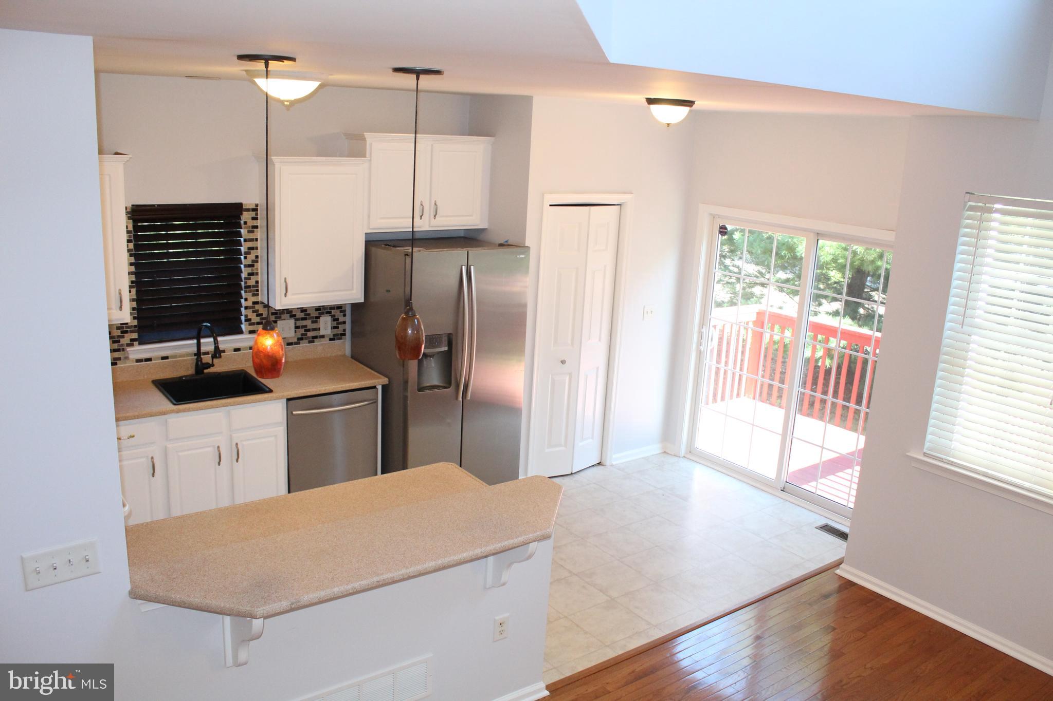 15 Ryan Court Telford, PA 18969 - Photo 12 of 26 a kitchen with stainless steel appliances a refrigerator sink and wooden floor