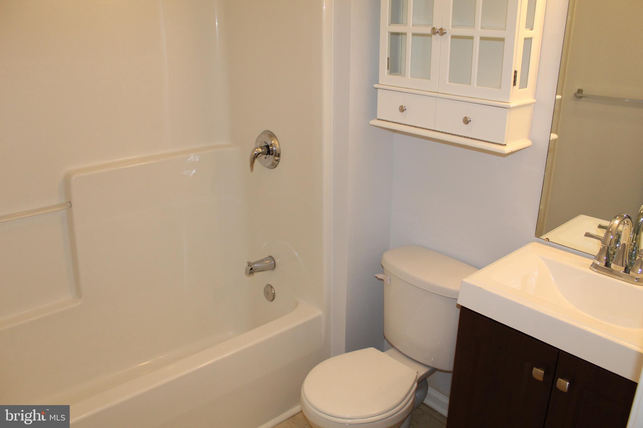 15 Ryan Court Telford, PA 18969 - Photo 24 of 26 a bathroom with a sink a toilet and shower
