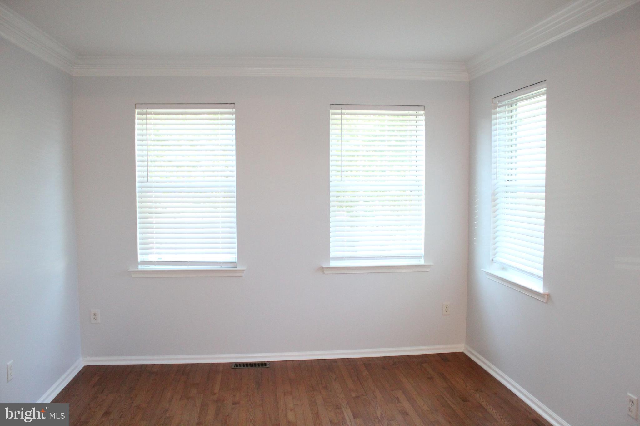 15 Ryan Court Telford, PA 18969 - Photo 5 of 26 a view of an empty room with wooden floor and a window