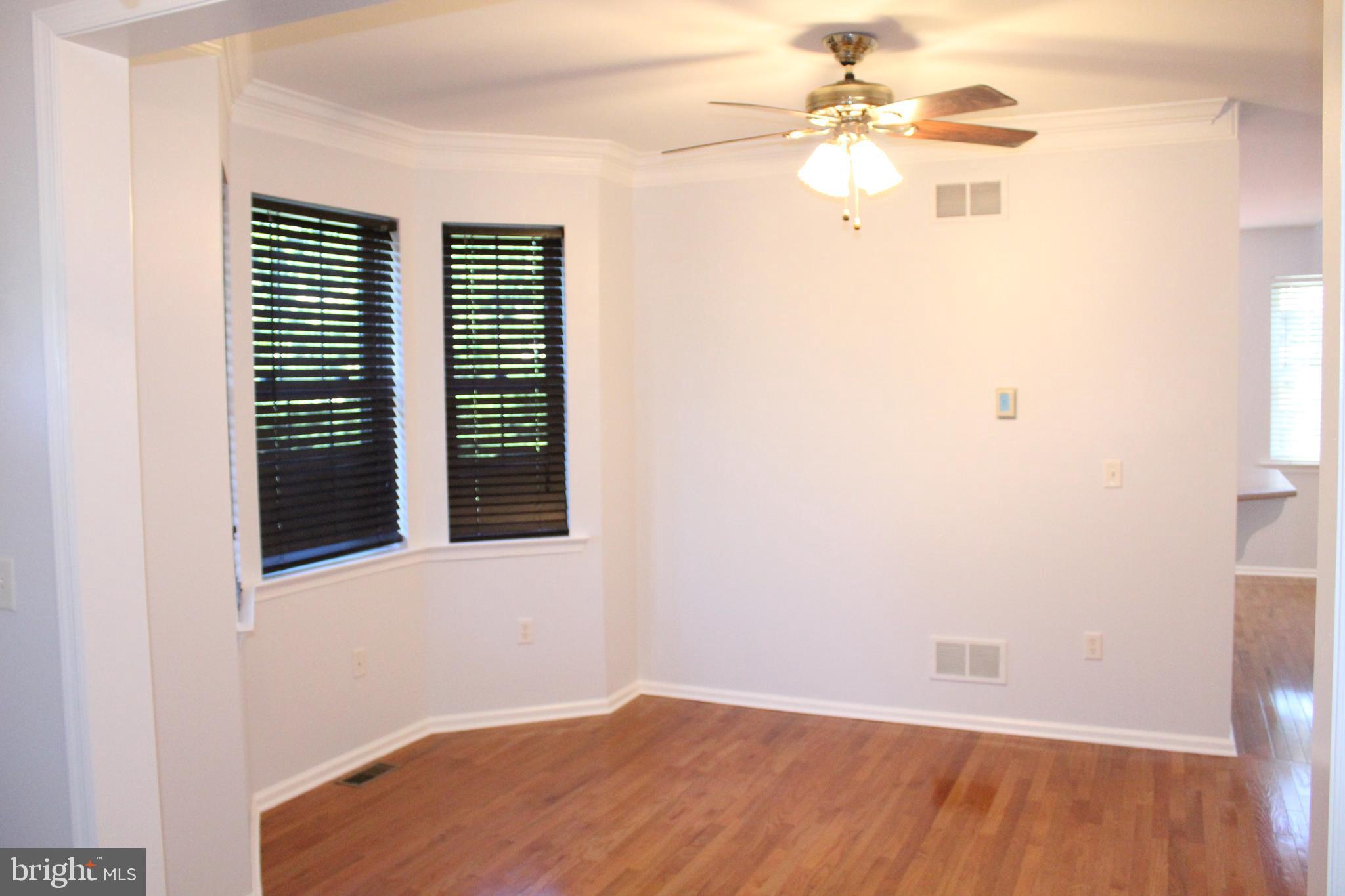 15 Ryan Court Telford, PA 18969 - Photo 7 of 26 an empty room with a window and a ceiling fan