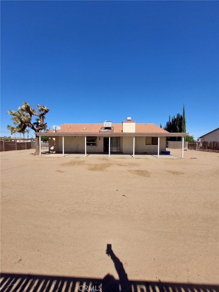 15811 Hercules Street Hesperia, CA 92345 - Photo 1 of 1 a house with trees in front of it