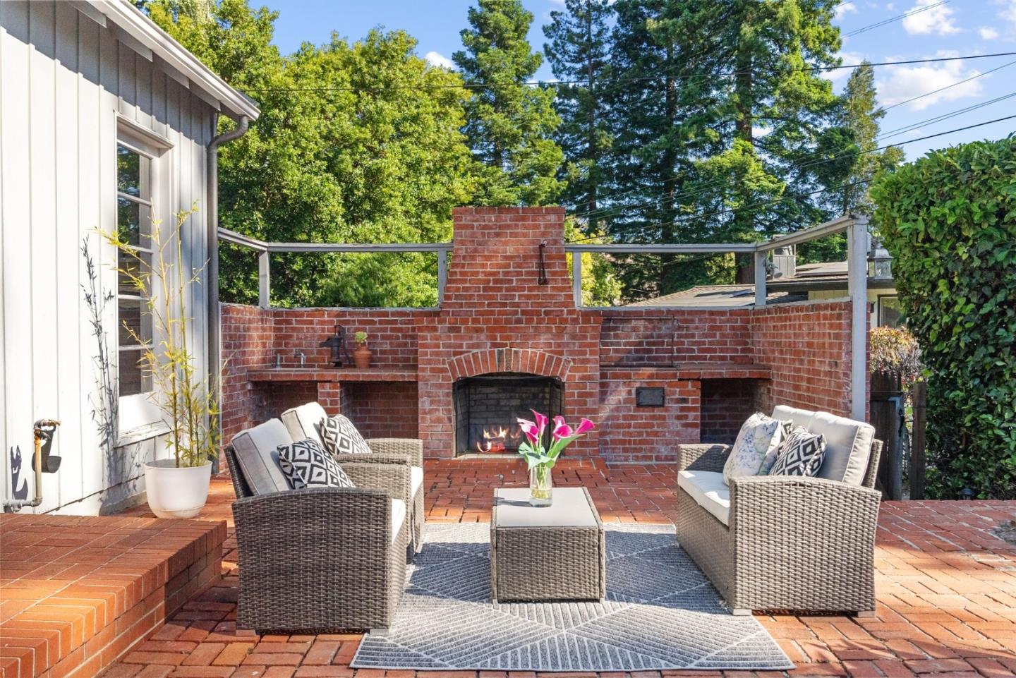 410 Fulton Road San Mateo, CA 94402 - Photo 11 of 49 a outdoor space with patio fireplace couches and a fireplace