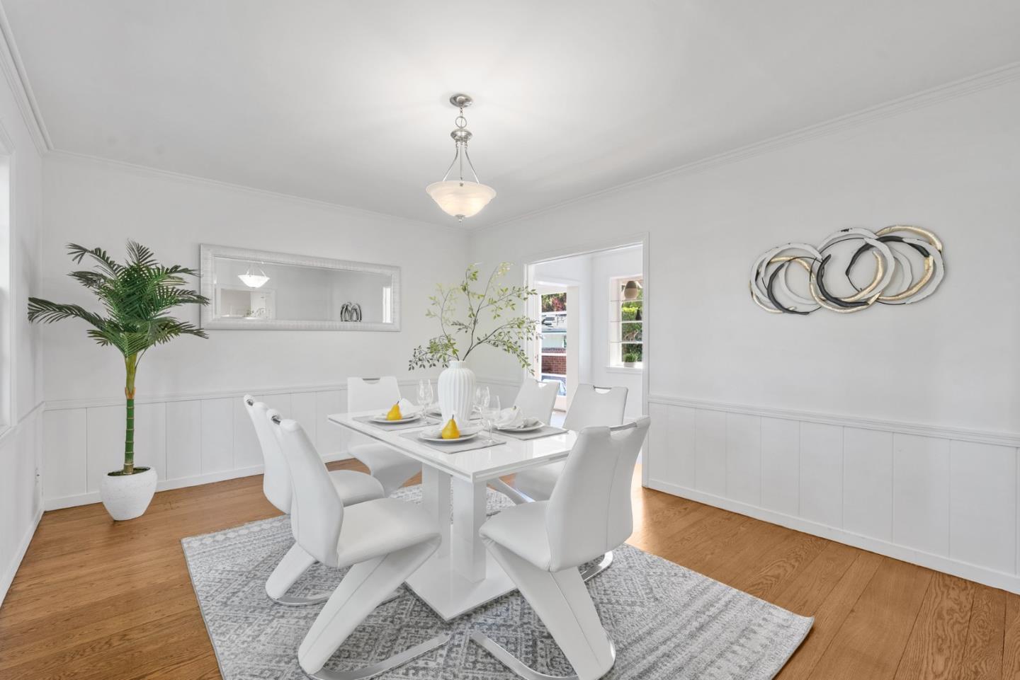 410 Fulton Road San Mateo, CA 94402 - Photo 17 of 49 a view of a dining room with furniture and wooden floor