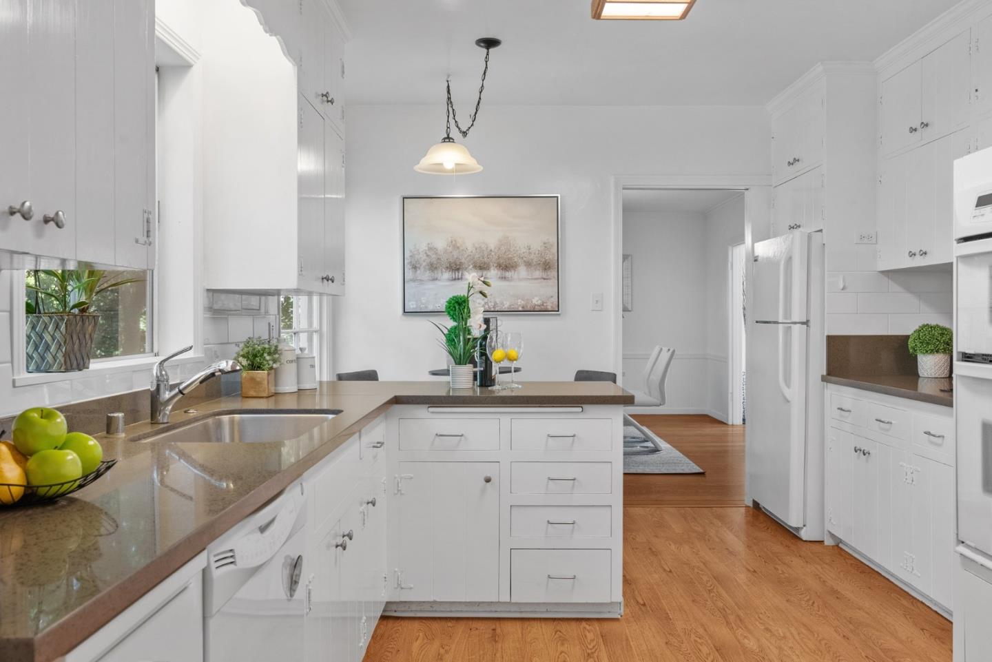 410 Fulton Road San Mateo, CA 94402 - Photo 21 of 49 a spacious kitchen with stainless steel appliances granite countertop a sink a stove counter space and cabinets