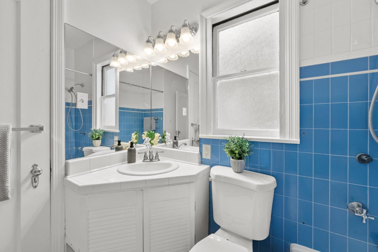 410 Fulton Road San Mateo, CA 94402 - Photo 27 of 49 a bathroom with a sink a toilet and a mirror