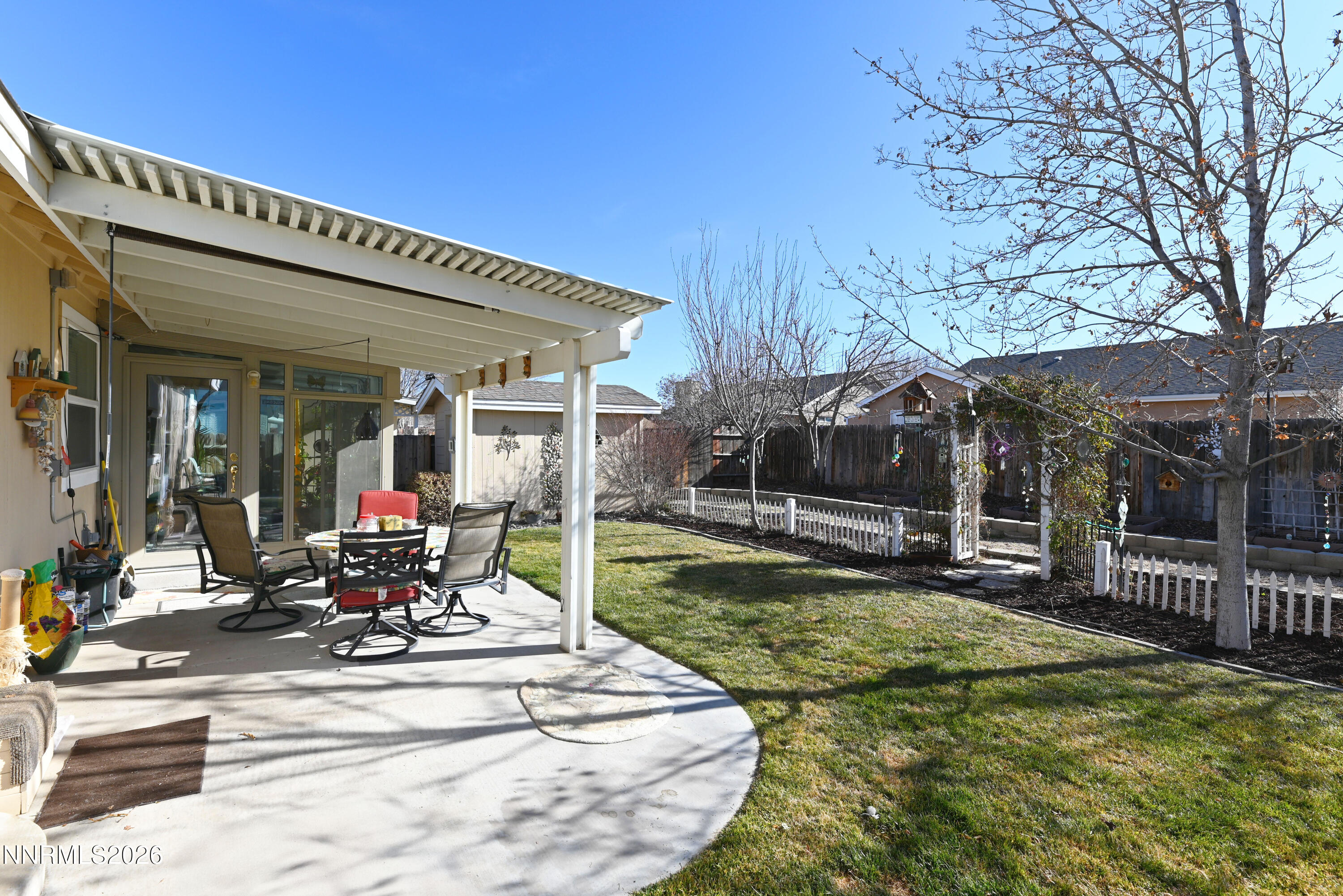413 Sunshine Lane Fernley, NV 89408 - Photo 2 of 10 a view of a house with backyard porch and sitting area