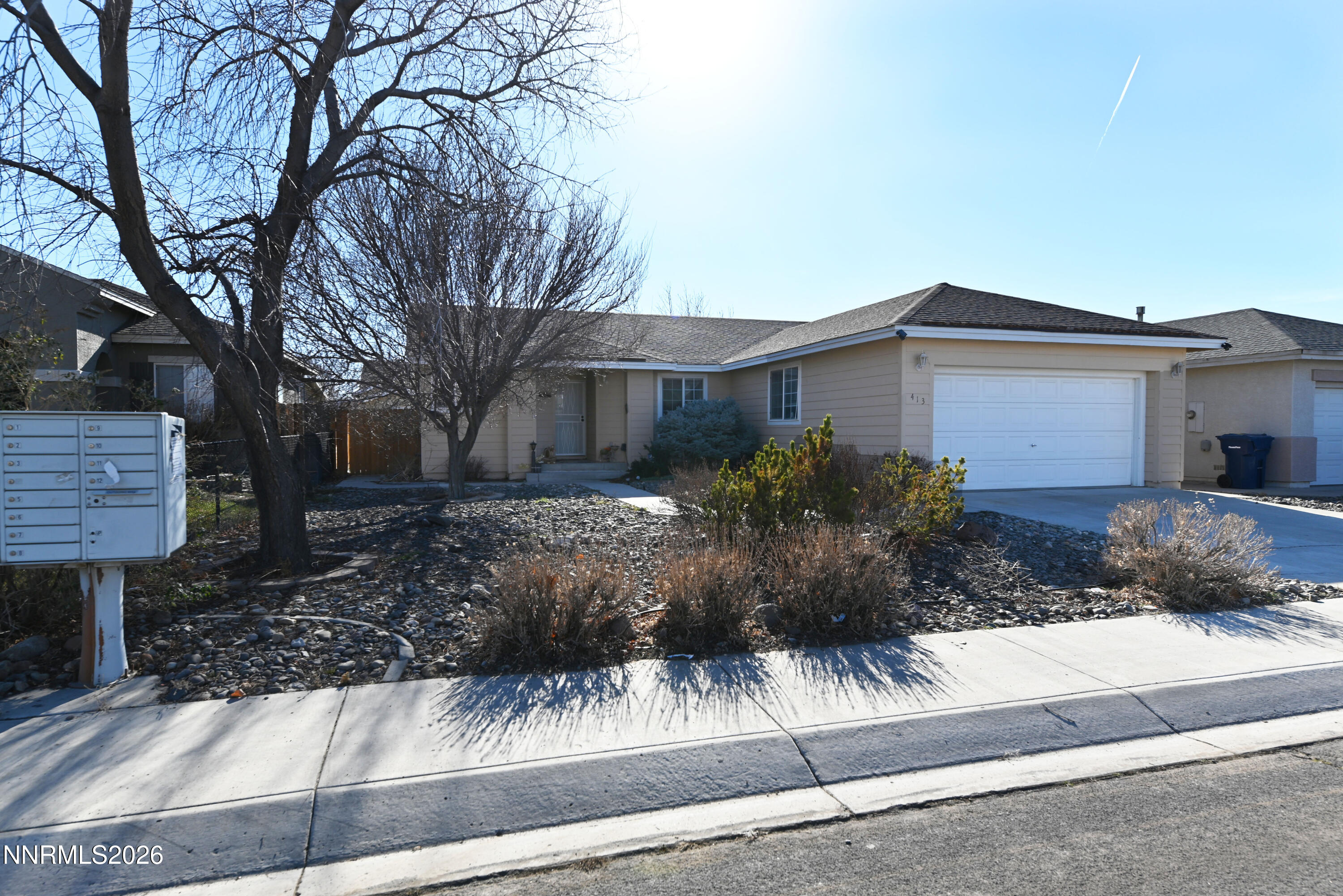 413 Sunshine Lane Fernley, NV 89408 - Photo 4 of 10 a view of a house with a yard