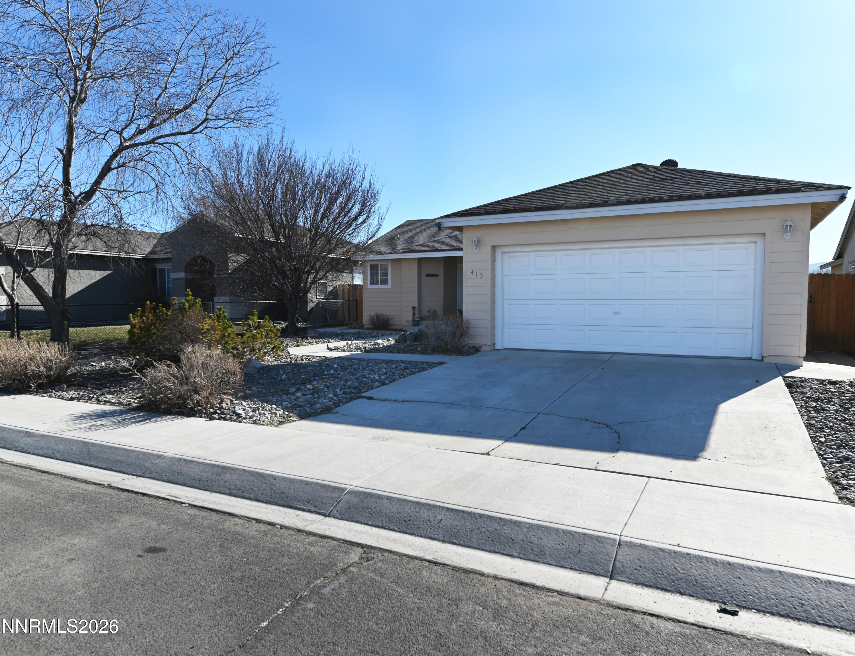 413 Sunshine Lane Fernley, NV 89408 - Photo 5 of 10 a front view of a house with yard