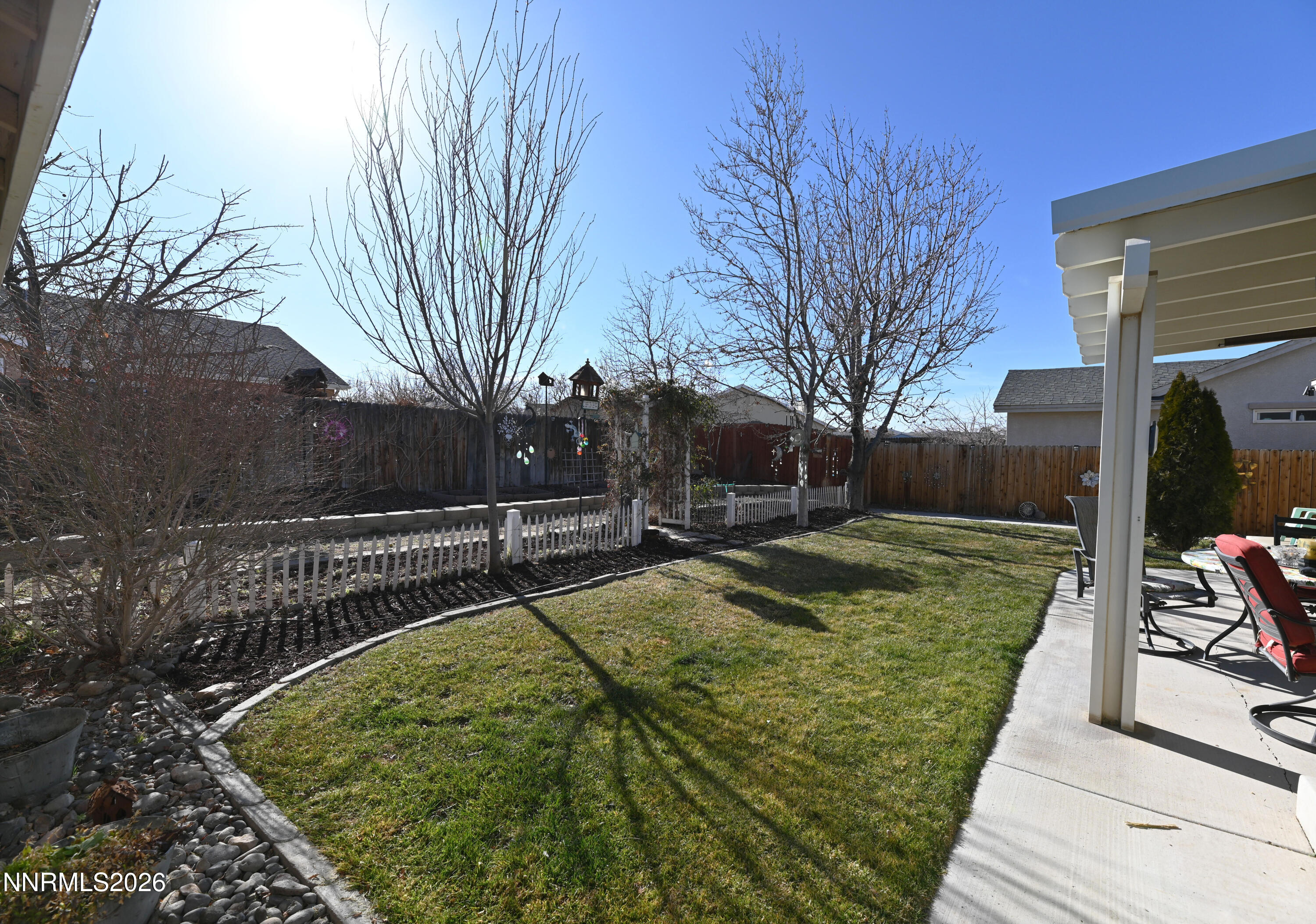 413 Sunshine Lane Fernley, NV 89408 - Photo 7 of 10 a view of a backyard with wooden fence