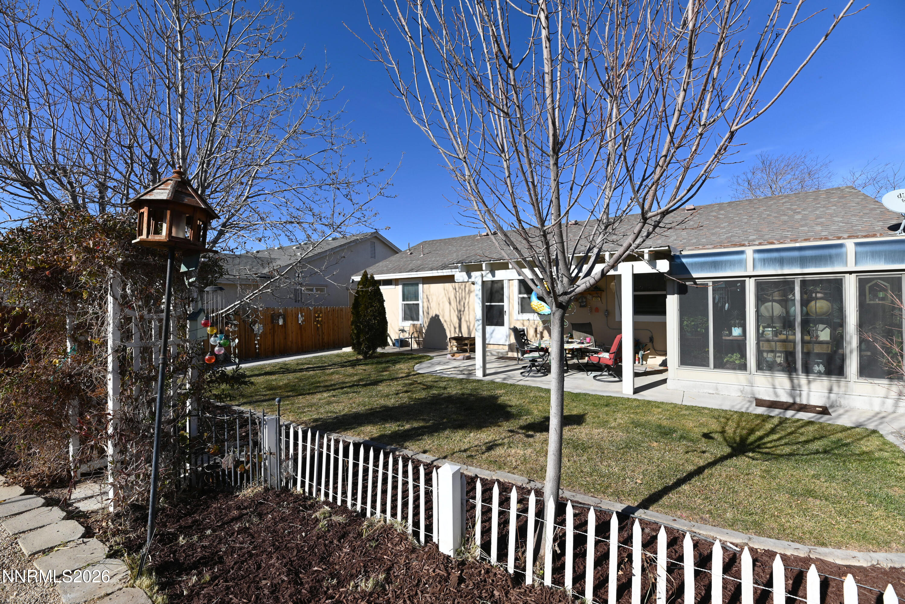 413 Sunshine Lane Fernley, NV 89408 - Photo 10 of 10 a view of a house with a yard and tree s
