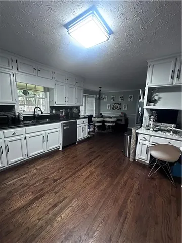 a kitchen with lots of counter top space and appliances