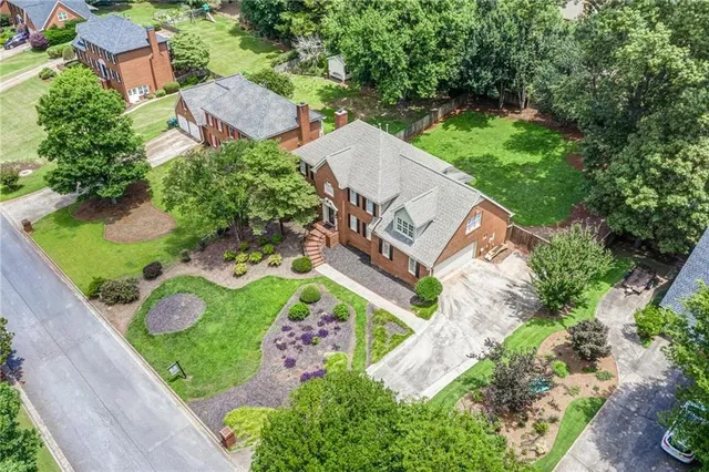 an aerial view of house with yard