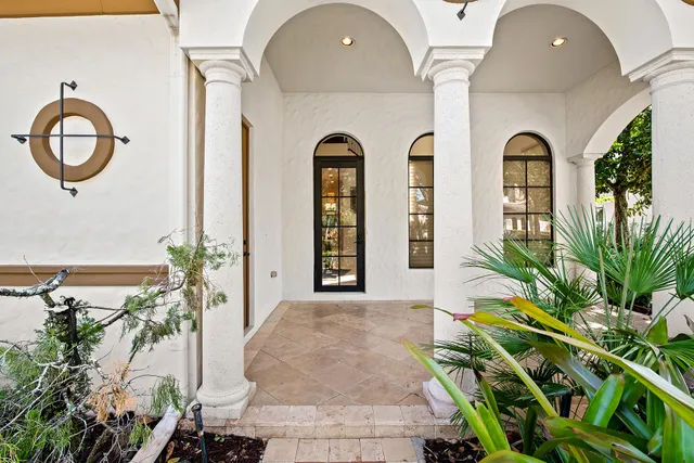 a view of a kitchen with granite countertop a stove and a sink