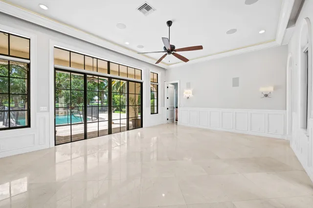 a view of entryway with wooden floor and windows