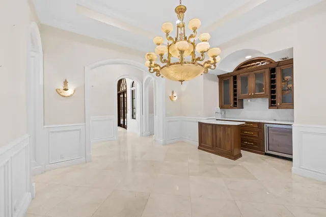 a kitchen with stainless steel appliances granite countertop a stove a sink dishwasher and a wooden cabinets