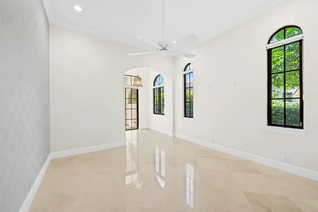 a bathroom with a granite countertop double vanity sink a mirror and a bathtub