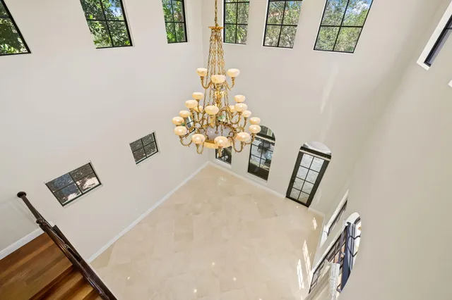a view of a patio with a table and chairs