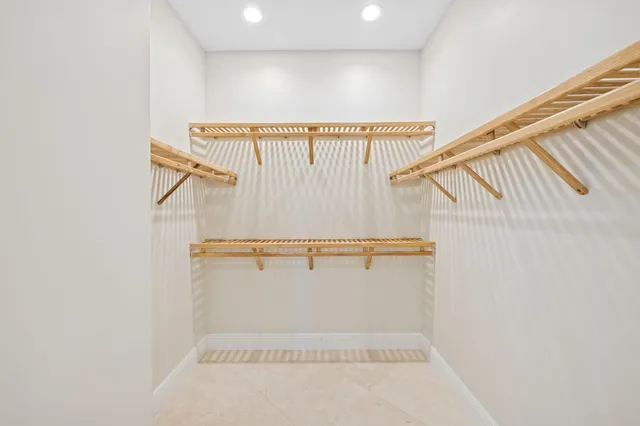 an aerial view of residential houses with outdoor space and river