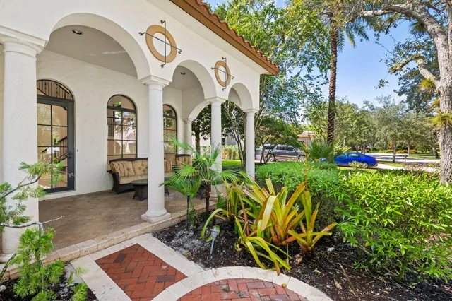 a living room with furniture tv and a large window