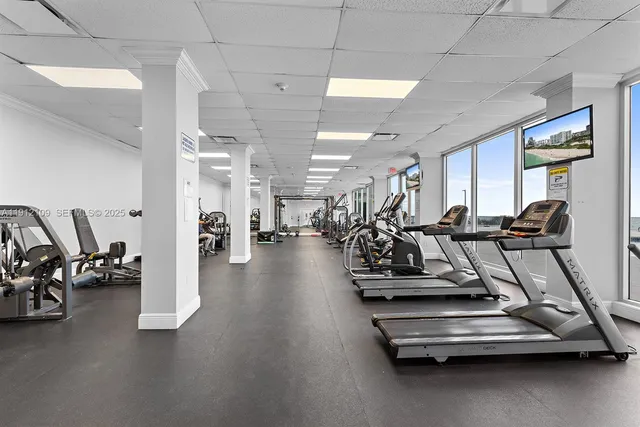 a dining room with furniture and a view of kitchen