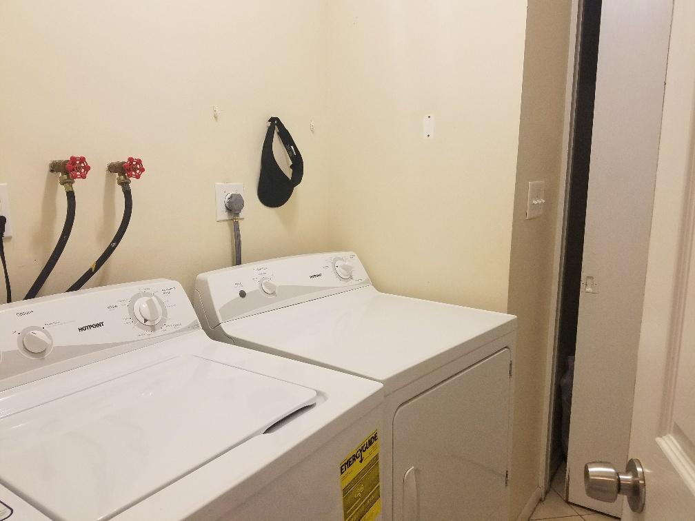 2007 Oleander Boulevard, Unit B Fort Pierce, FL 34950 - Photo 17 of 17 a utility room with dryer and washer