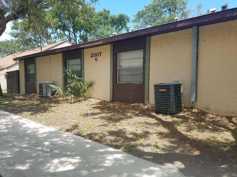 2007 Oleander Boulevard, Unit B Fort Pierce, FL 34950 - Photo 2 of 17 a view of a house with a backyard