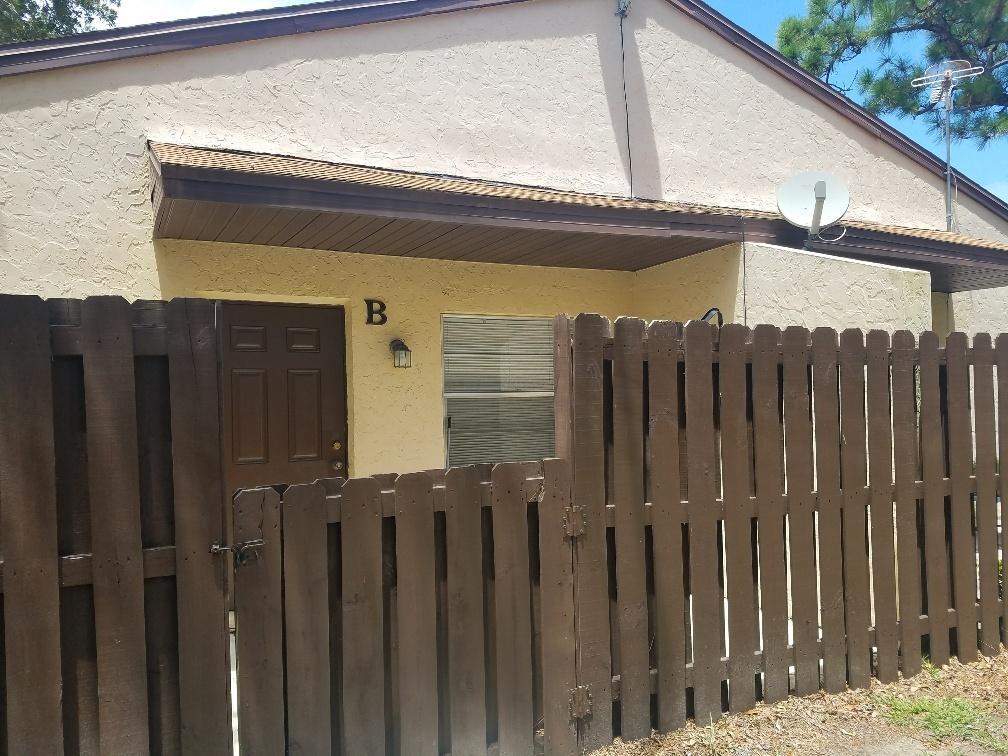 2007 Oleander Boulevard, Unit B Fort Pierce, FL 34950 - Photo 4 of 17 a view of a house with a wooden fence