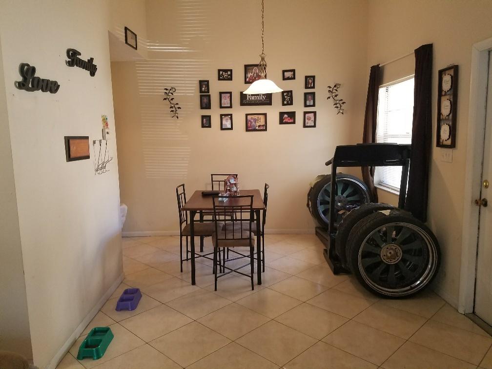 2007 Oleander Boulevard, Unit B Fort Pierce, FL 34950 - Photo 9 of 17 a view of a livingroom with furniture and windows