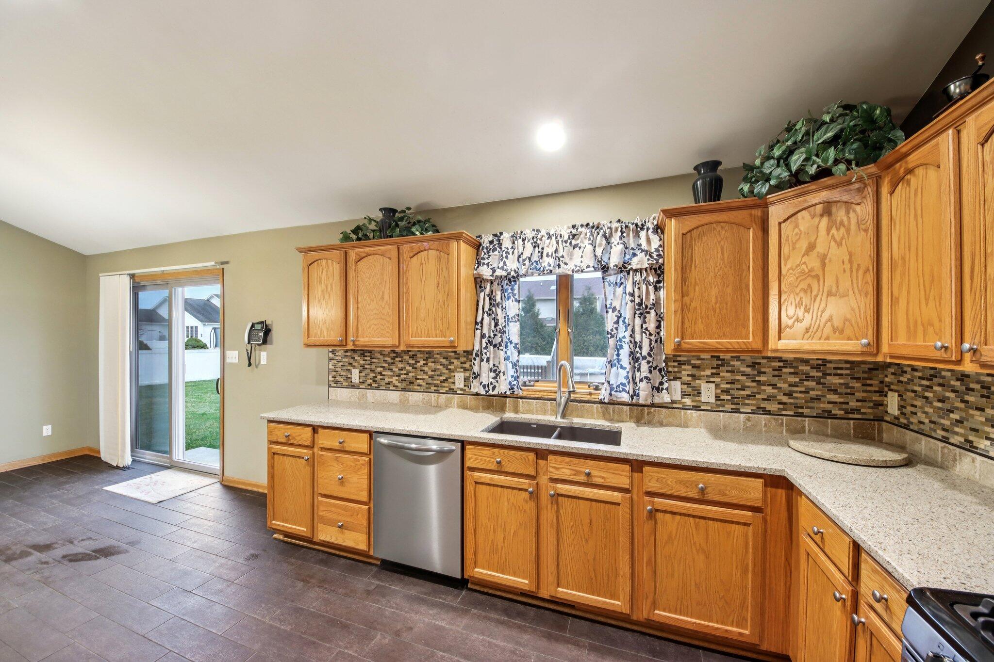 9396 Calumet Street Dyer, IN 46311 - Photo 13 of 43 a bathroom with a sink double vanity granite and a mirror