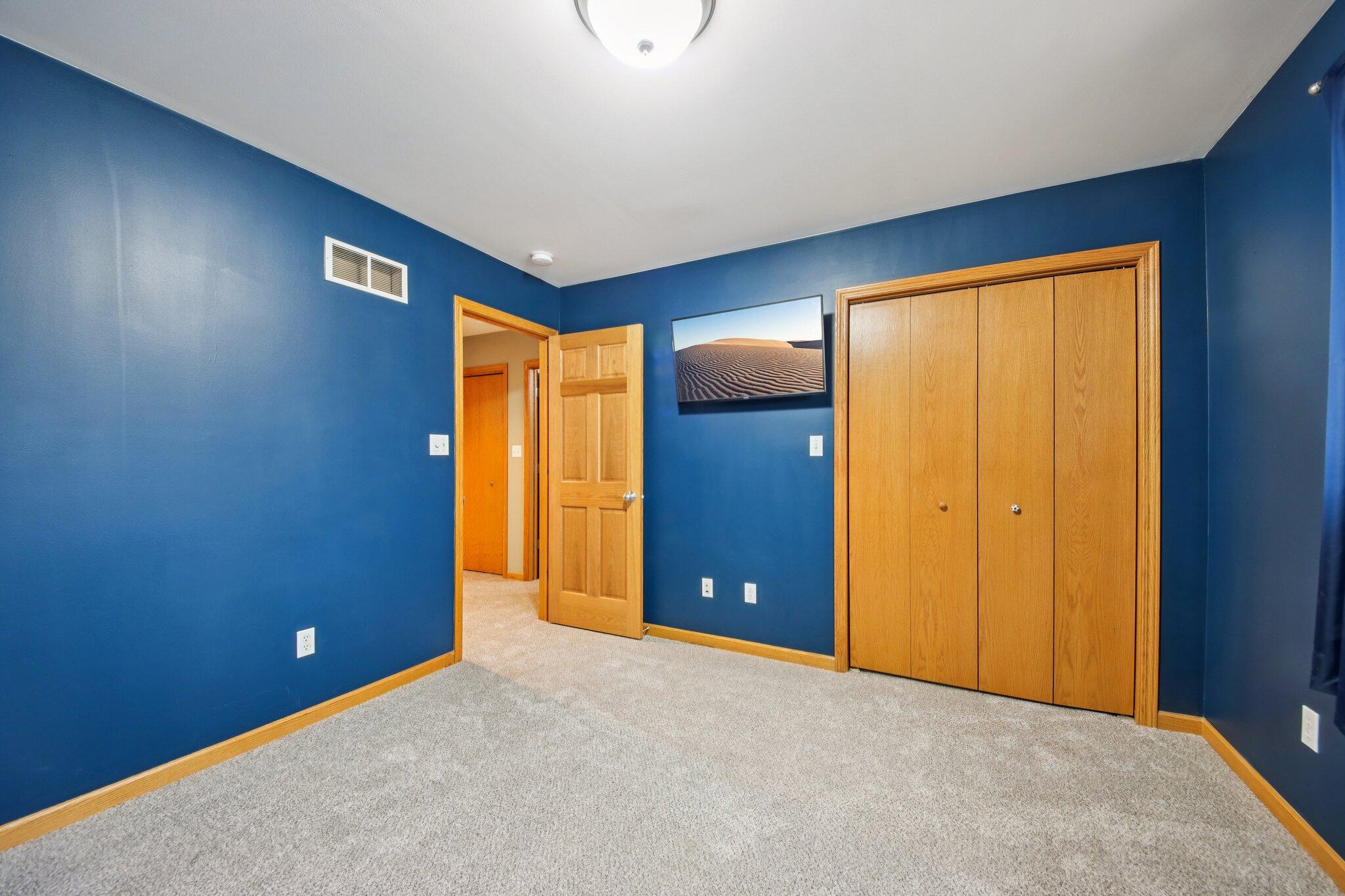 9396 Calumet Street Dyer, IN 46311 - Photo 23 of 43 a view of an empty room with closet and wooden door