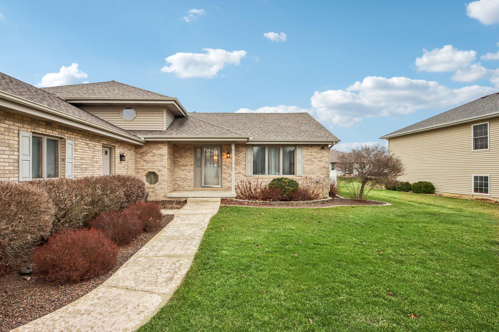 9396 Calumet Street Dyer, IN 46311 - Photo 5 of 43 a front view of a house with garden