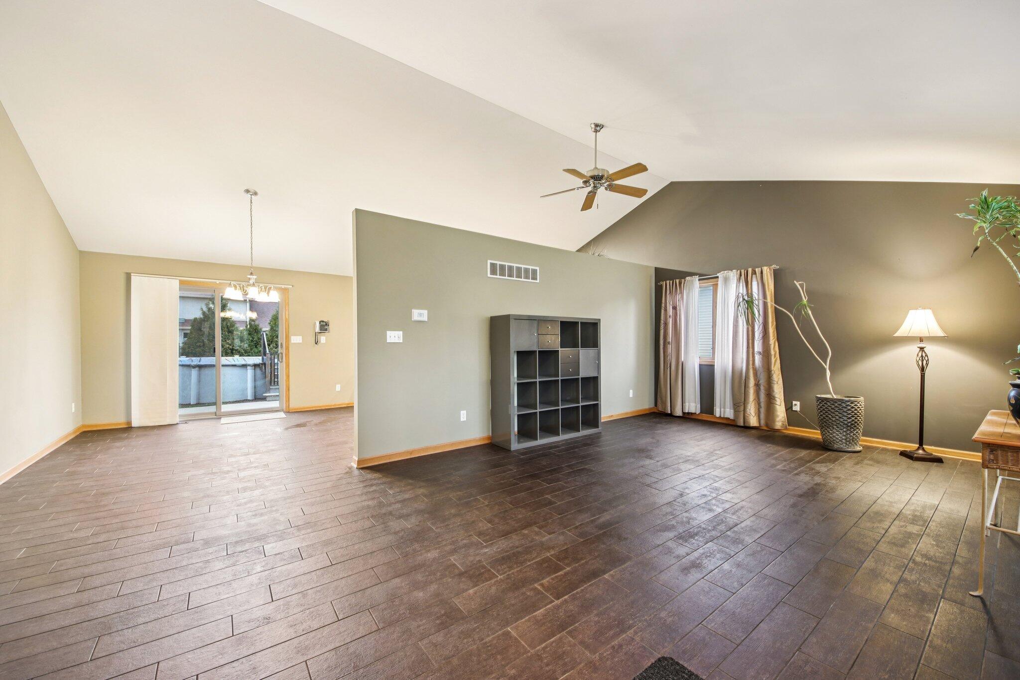 9396 Calumet Street Dyer, IN 46311 - Photo 7 of 43 a view of a livingroom with wooden floor and staircase