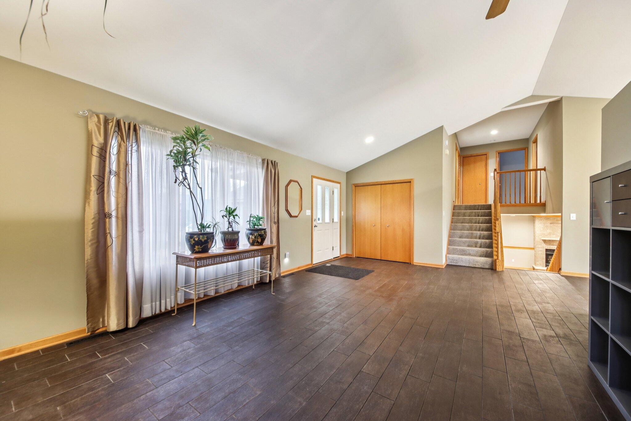 9396 Calumet Street Dyer, IN 46311 - Photo 9 of 43 a view of a livingroom with furniture and an empty room